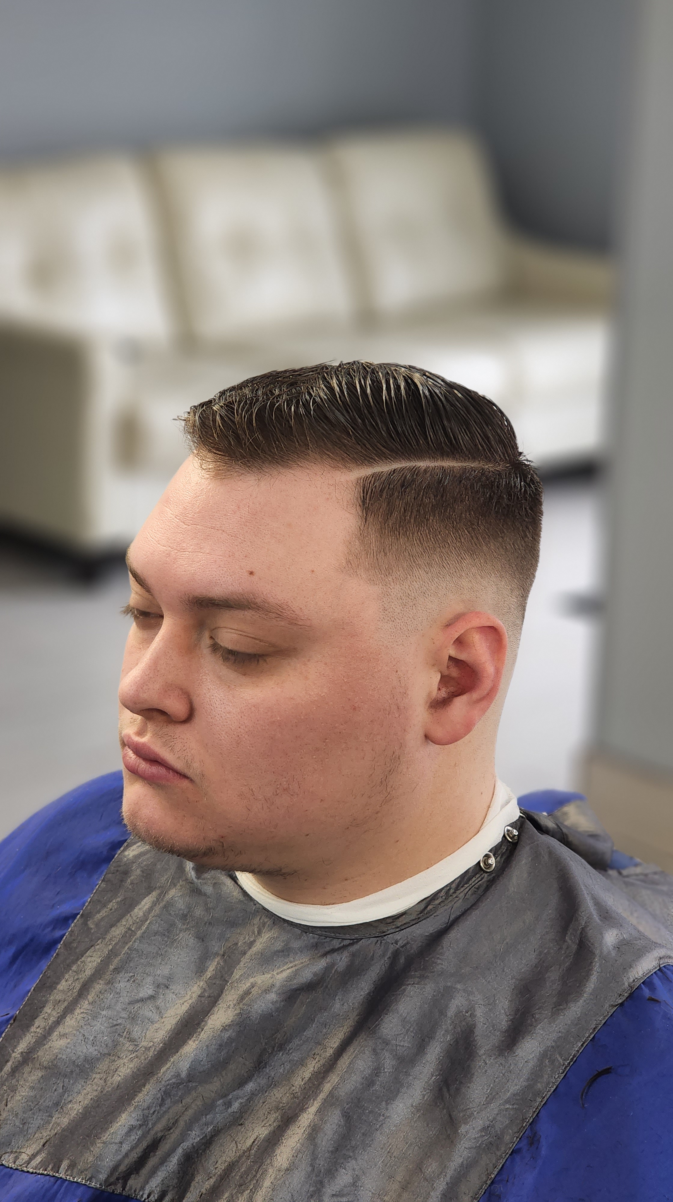 Classic comb-over haircut with hard part